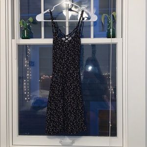 back dress with little shapes on it.